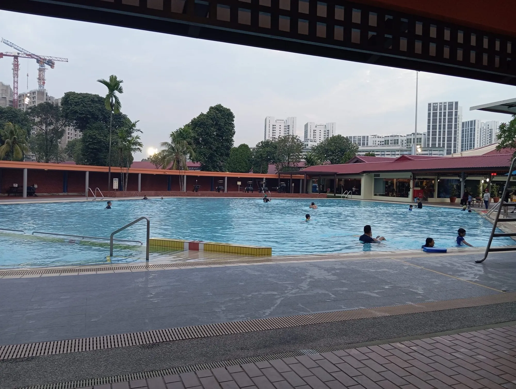 Families swimming in the teaching pool in the early evening