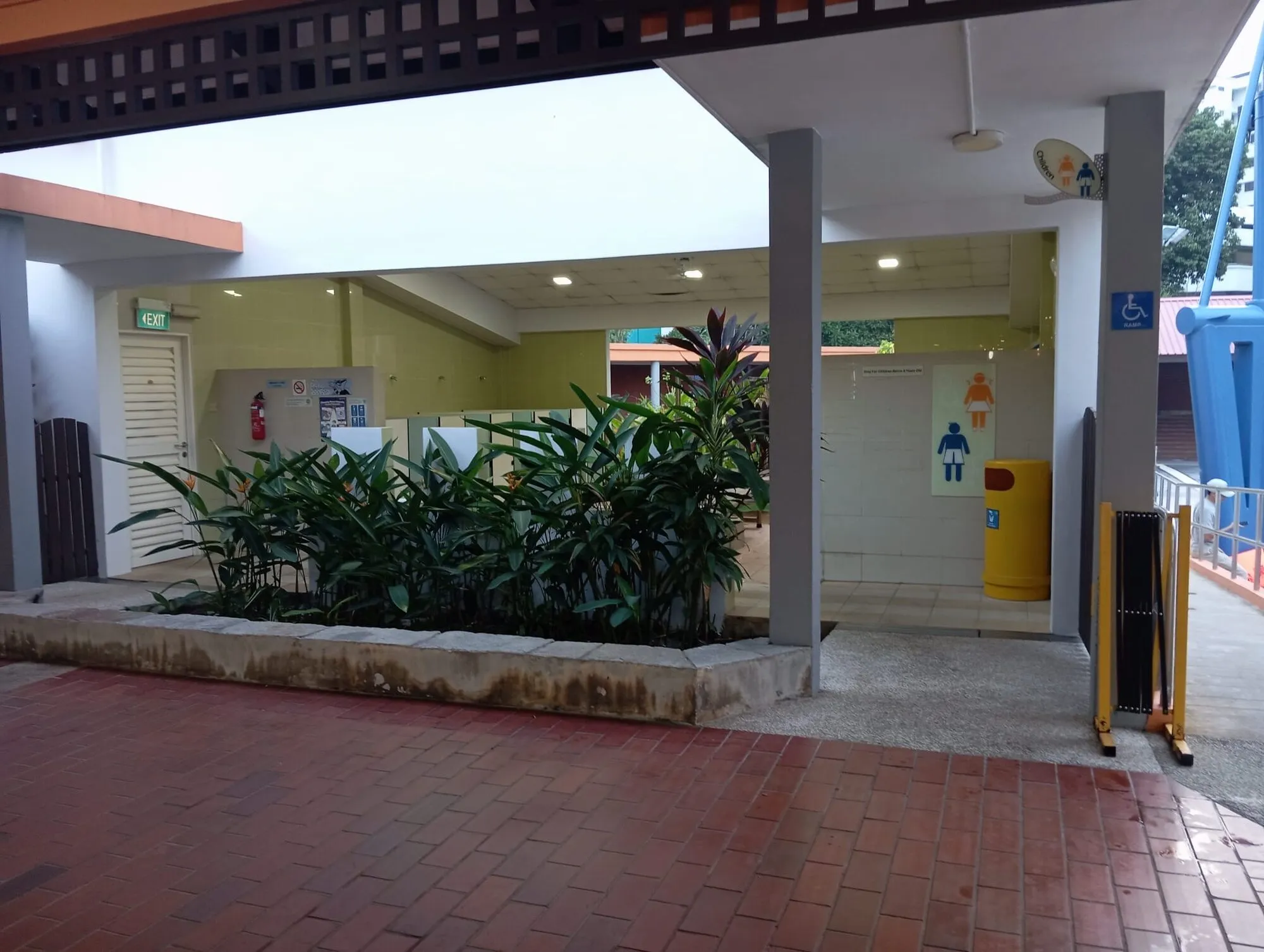 The toilet block entrance with male, female and wheelchair-accessible signs